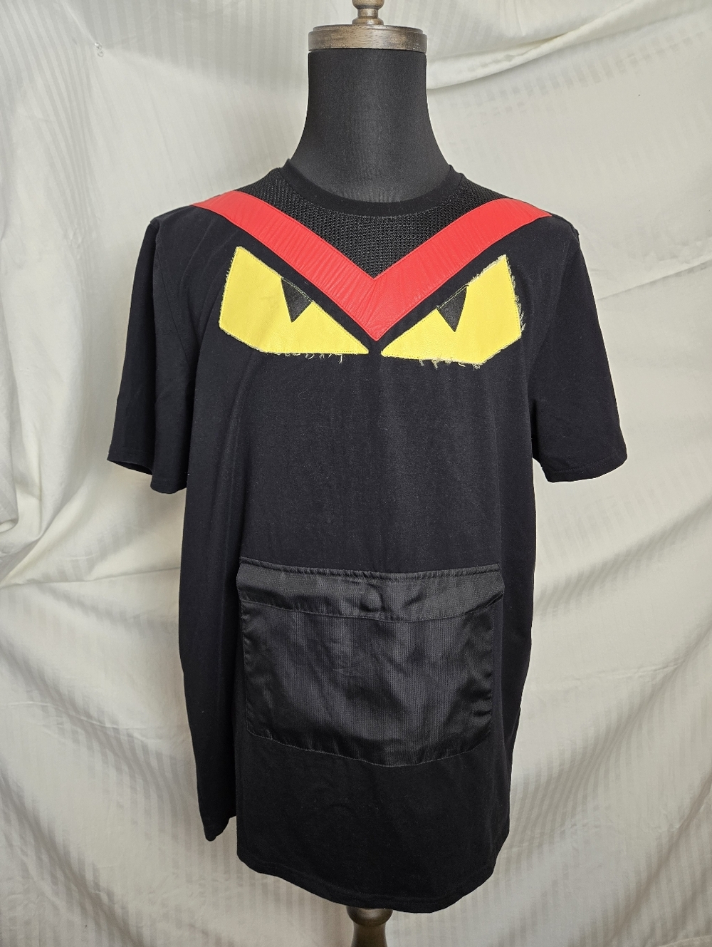 Hidson Graphic Pocket Tee with Red and Yellow Accents.   TM